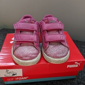 PUMA sneakers.